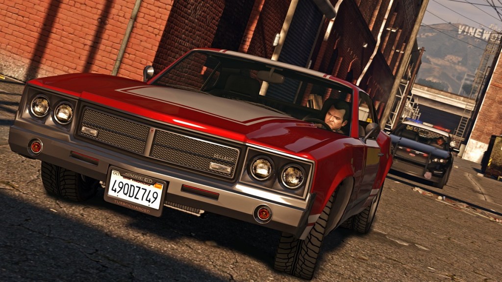 GTA 5: Michael in a red sports car.