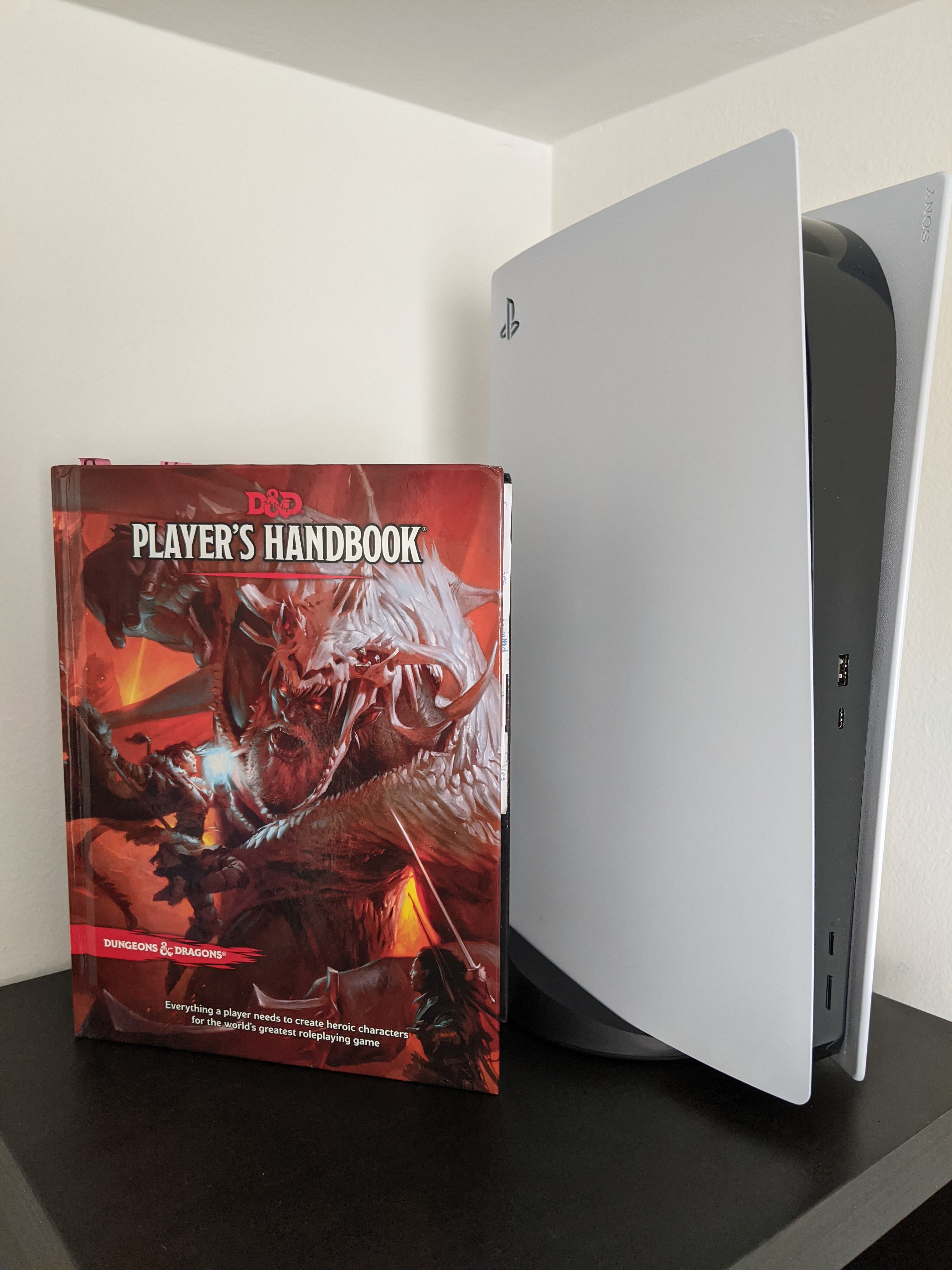 PS5 Next to D&D Player's Handbook