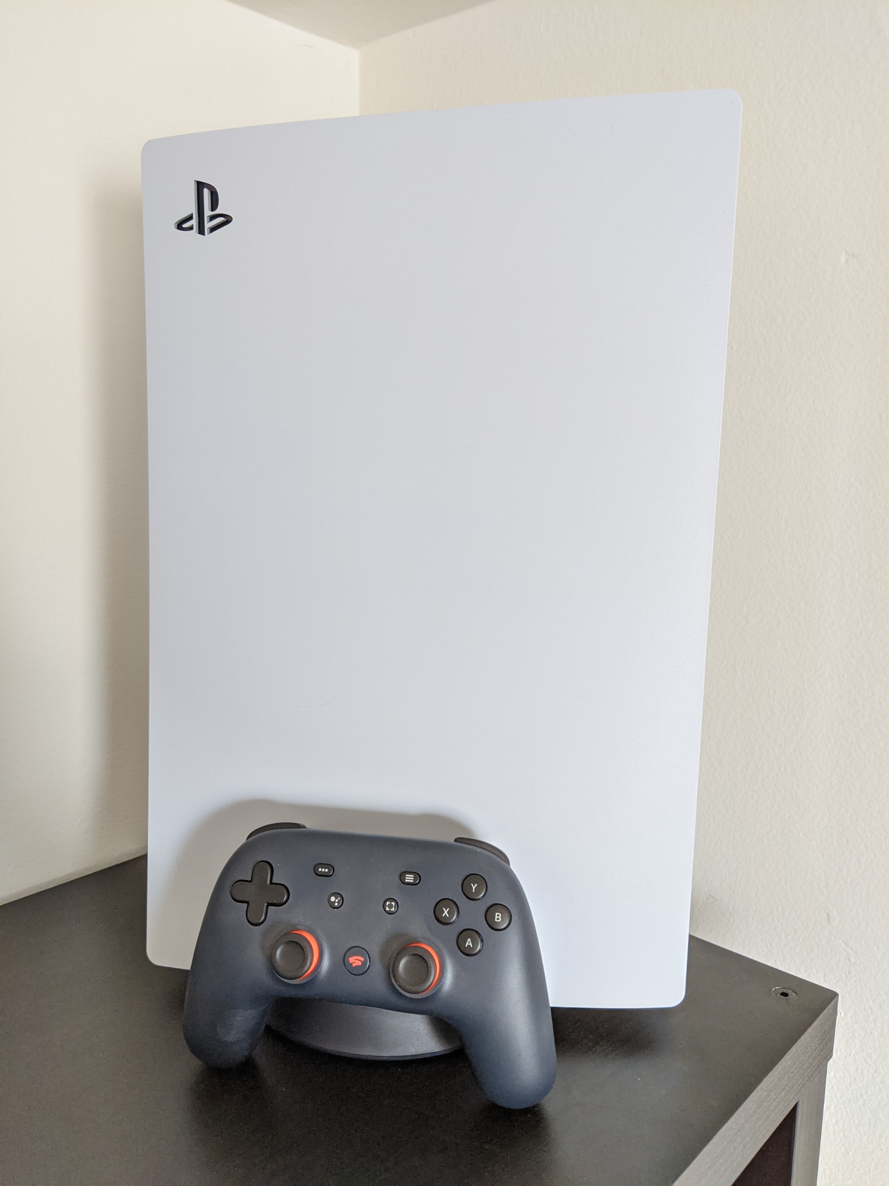 PS5 Next to a Stadia Founder's Edition Controller
