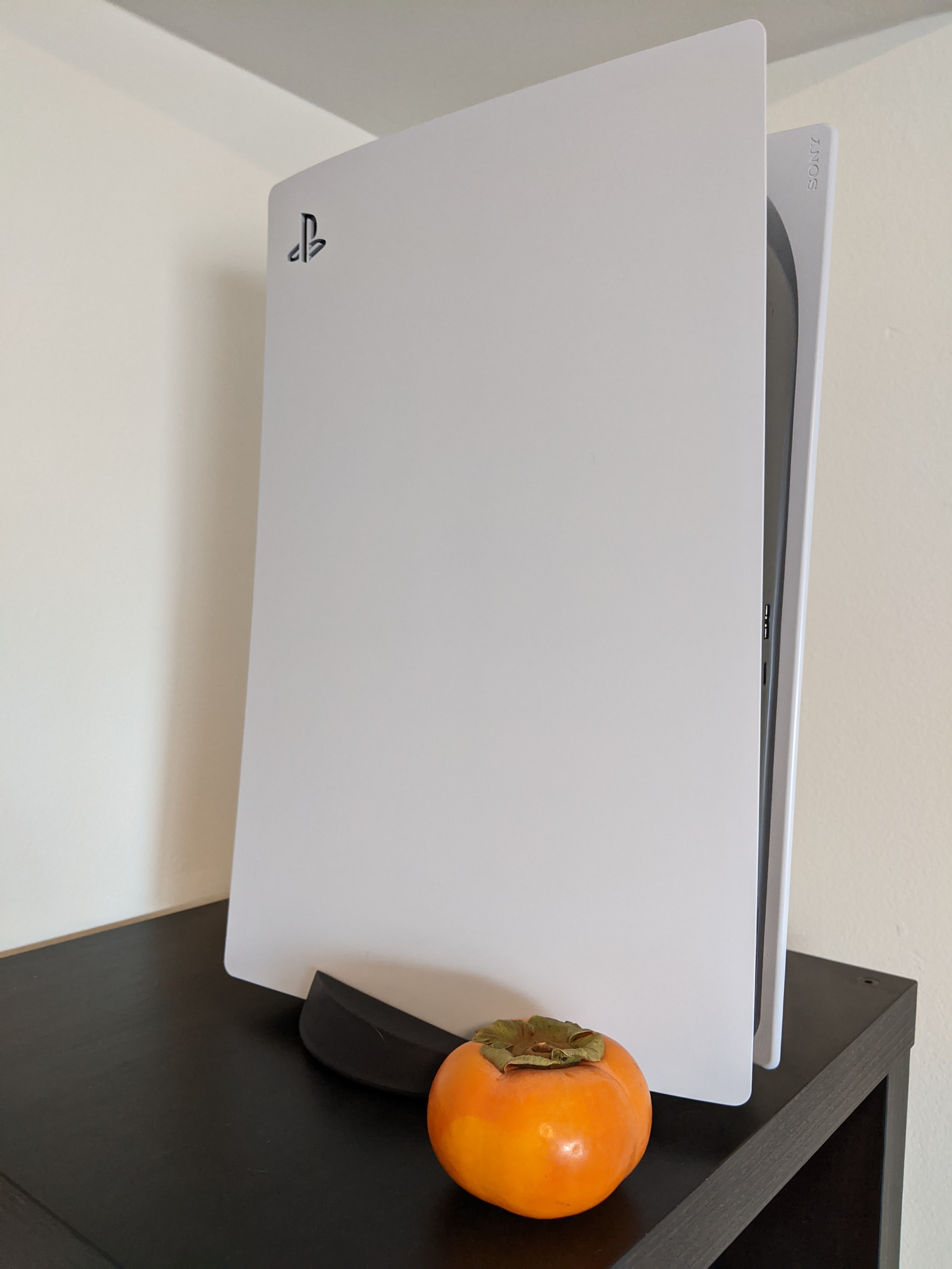 PS5 Next to a Persimmon